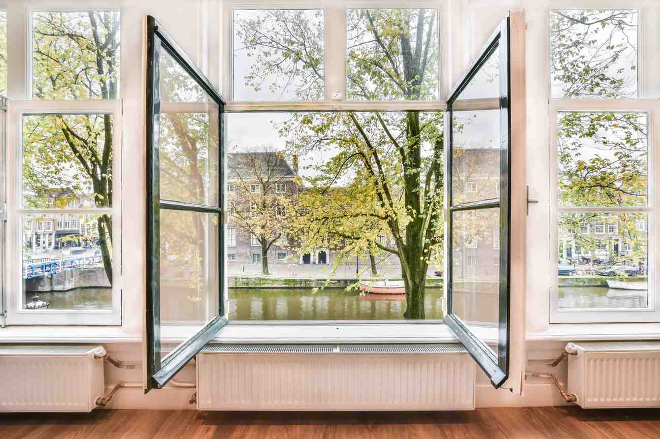 Open window with low-E glass for cooler home renovation in Singapore