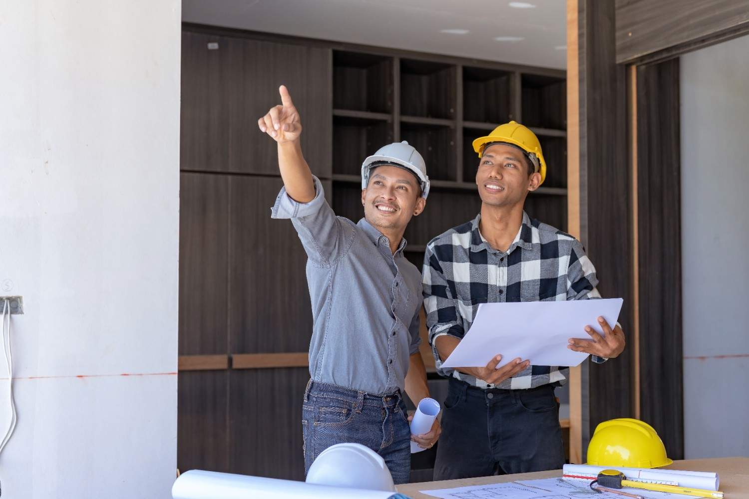 Engineers inspecting renovation site, recommend interior design firm Singapore by Hausmark